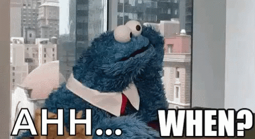 A Cookie Monster Is Sitting In Front Of A Window And Says Ahh When GIF