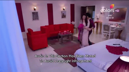 a couple dancing in a living room with the words audio in this section has been muted to avoid copyright infringement at