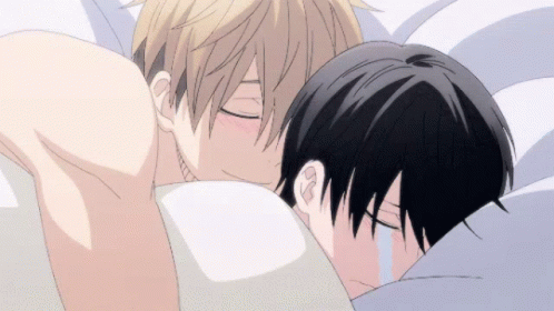 A Couple Of Anime Characters Hugging Each Other In Bed GIF