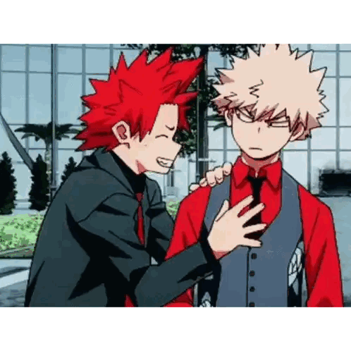 a couple of anime characters standing next to each other . one of the characters is wearing a red shirt and tie .