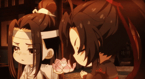 A Couple Of Anime Characters With One Holding A Flower GIF