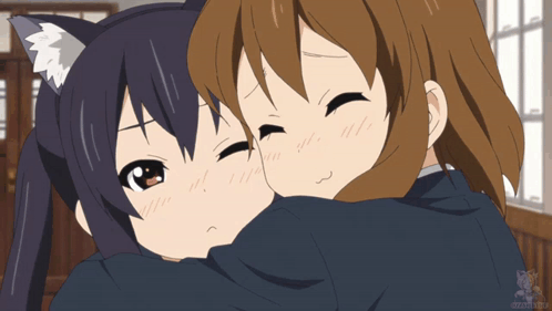 A Couple Of Anime Girls Hugging Each Other With A Cat Ear GIF
