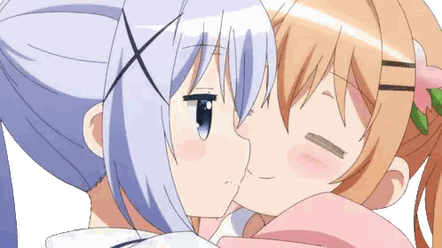 a couple of anime girls kissing each other on the cheek