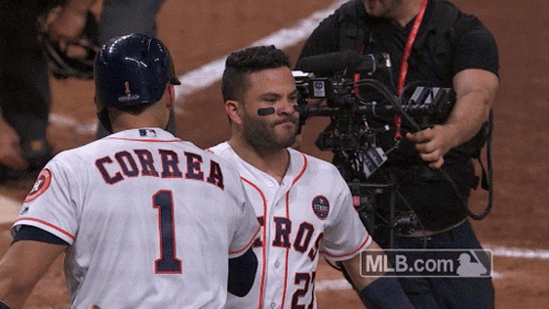 A Couple Of Baseball Players One Of Whom Has Correa On The Back Of His Jersey GIF