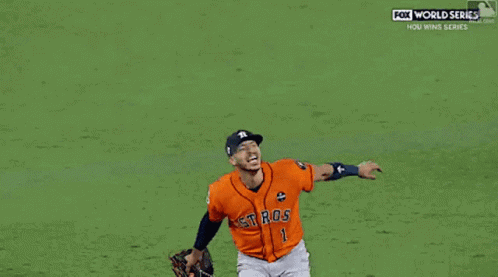 A Couple Of Baseball Players One Of Whom Has The Number 27 On His Jersey GIF