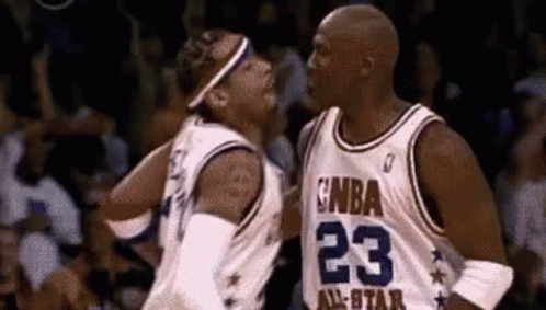 A Couple Of Basketball Players Are Standing Next To Each Other On A Court . GIF