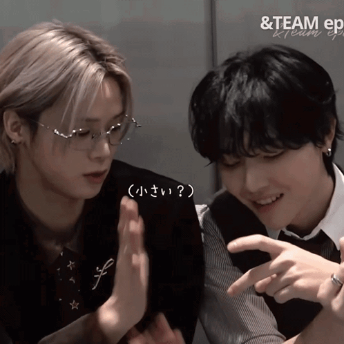 A Couple Of Boys Are Sitting Next To Each Other With The Words & Team Ep Written On The Bottom GIF