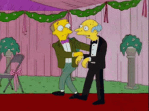 A Couple Of Cartoon Characters Are Standing Next To Each Other On A Red Carpet GIF