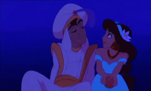 A Couple Of Cartoon Characters Sitting Next To Each Other In The Dark GIF
