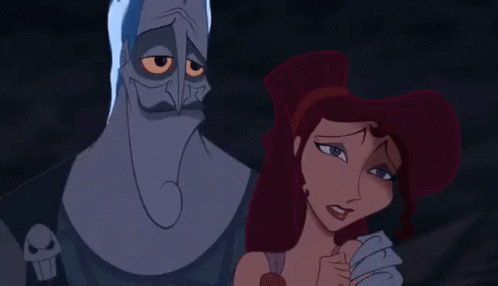 A Couple Of Cartoon Characters Standing Next To Each Other . GIF