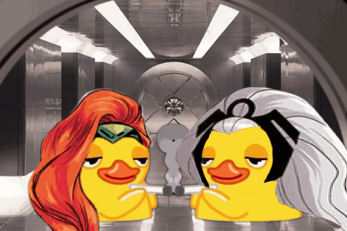 A Couple Of Cartoon Ducks Are Sitting Next To Each Other In A Room GIF