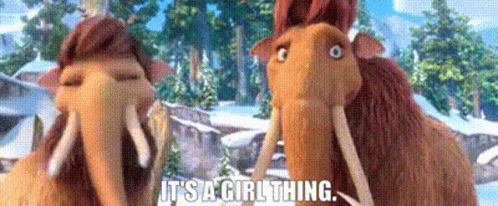 A Couple Of Cartoon Elephants Are Standing Next To Each Other In The Snow . GIF