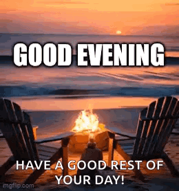 A Couple Of Chairs Sitting Next To A Fire On A Beach At Sunset . GIF
