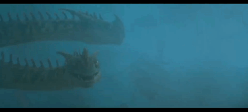 A Couple Of Dinosaurs Swimming In The Water . GIF