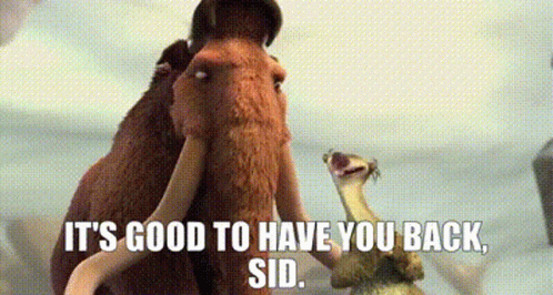 A Couple Of Mammoths Standing Next To Each Other With The Words `` It 'S Good To Have You Back , Sid '' . GIF