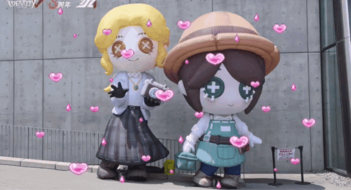 a couple of mascots are standing next to each other with hearts around them and the word identity in the background