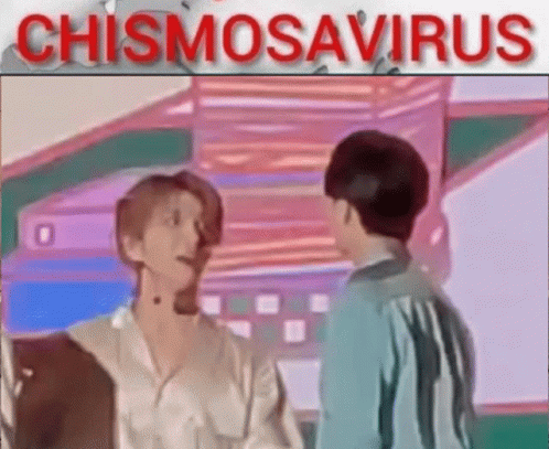 A Couple Of Men Are Standing Next To Each Other In A Room And Talking To Each Other . GIF