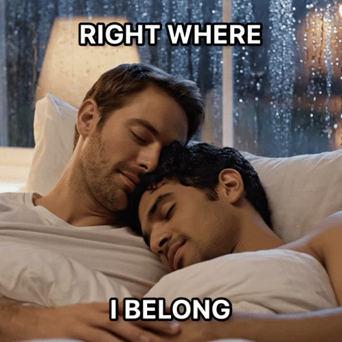 A Couple Of Men Laying In Bed With The Caption Right Where I Belong GIF