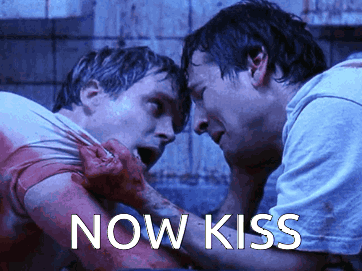 Men Standing Next To Each Other Kiss GIF