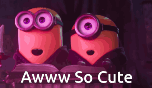A Couple Of Minions Sitting Next To Each Other With The Words Awww So Cute On The Bottom GIF