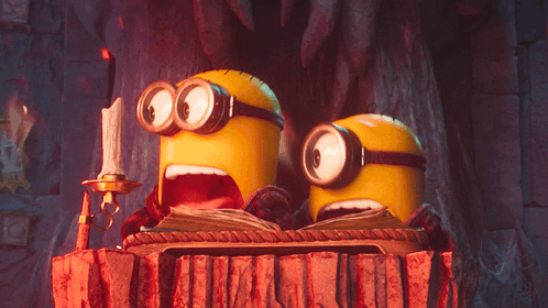 A Couple Of Minions With Their Mouths Open GIF