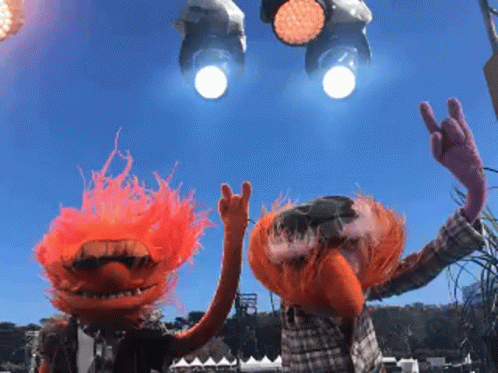 A Couple Of Muppets Giving The Horns Sign With Their Hands GIF