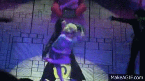 A Couple Of People Are Dancing On A Stage With A Makeagif.com Logo In The Corner . GIF