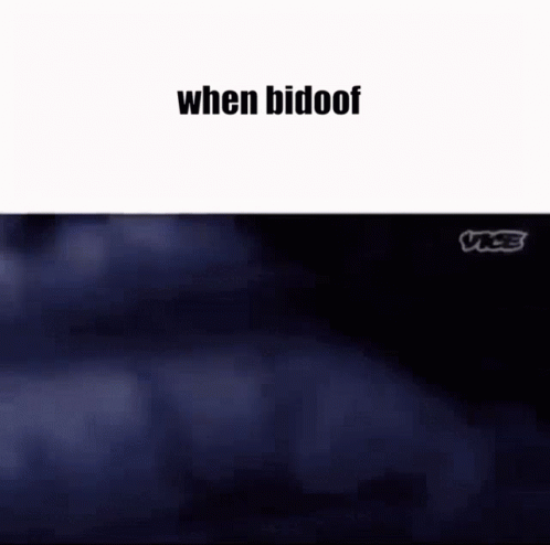 A Couple Of People Are Standing Next To Each Other In A Park . GIF