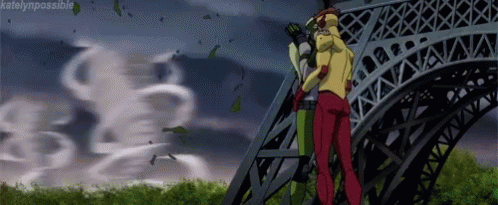A Couple Of People Are Standing On Top Of A Very Tall Building . GIF