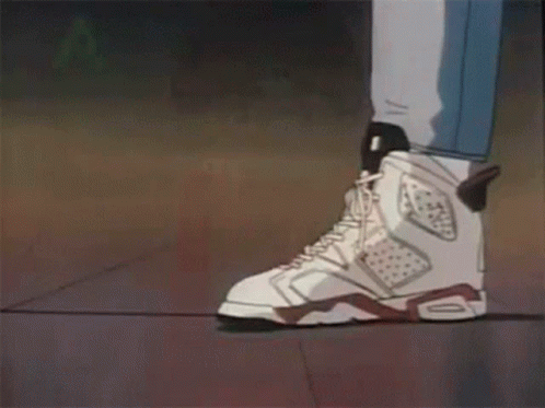 A Couple Of People Standing Next To Each Other Wearing White Sneakers . GIF