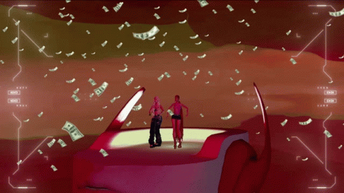 A Couple Of People Standing On Top Of A Boat With Money Flying Around GIF