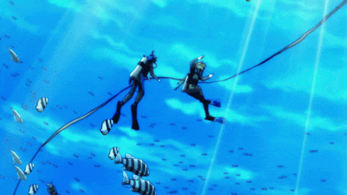 A Couple Of Scuba Divers Are Swimming In The Ocean With Fish GIF