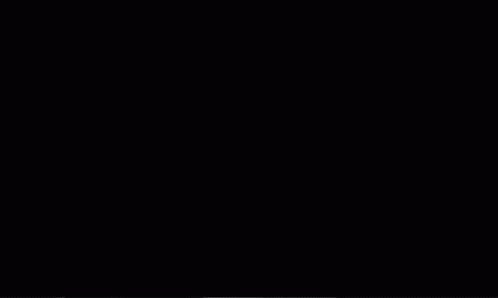 A Couple Of Skeletons Are Dancing On A Stage GIF