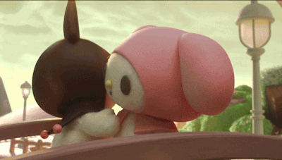 a couple of stuffed animals are hugging each other