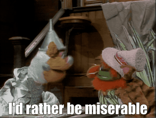 A Couple Of Stuffed Animals Standing Next To Each Other With The Words I 'D Rather Be Miserable Above Them GIF