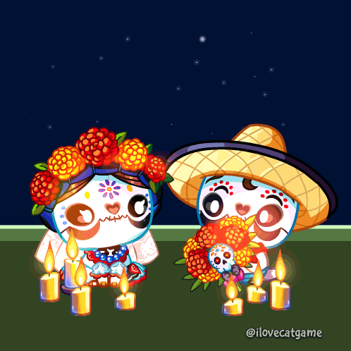 A Couple Of Sugar Skulls Sitting Next To Each Other GIF
