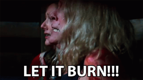 A Couple Of Women Are Sitting Next To Each Other With Their Faces Covered In Blood . GIF