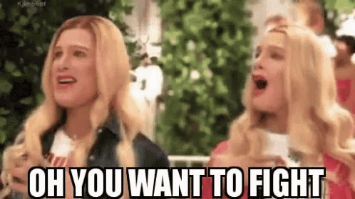 A Couple Of Women Are Standing Next To Each Other And One Of Them Is Screaming . GIF