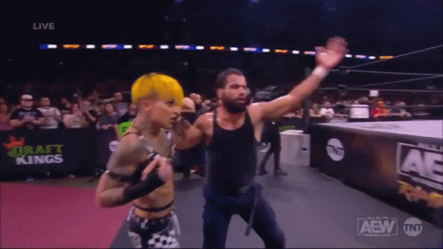 A Couple Of Wrestlers In A Ring With The Word Aew On The Bottom GIF