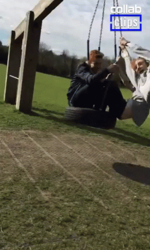 A Couple Sitting On A Tire Swing With The Words Collab Clips On The Bottom GIF