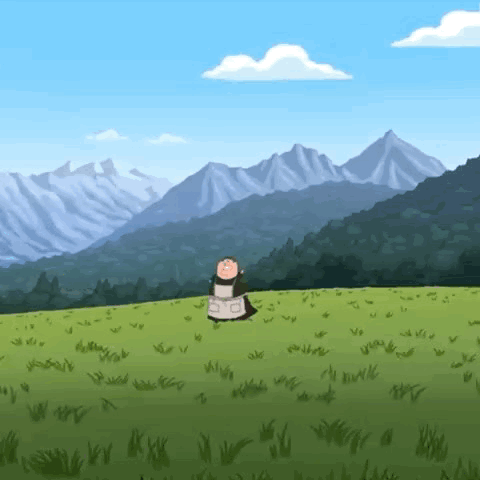 A Cow Is Standing In A Grassy Field With Mountains In The Background . GIF