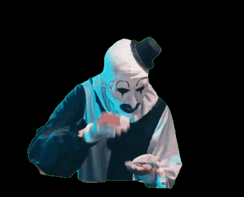 A Creepy Clown With A Top Hat And A White Mask GIF