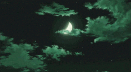 A Crescent Moon In A Dark Night Sky With Green Clouds . GIF