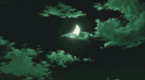 A Crescent Moon Is Visible In A Dark Sky With Green Clouds GIF