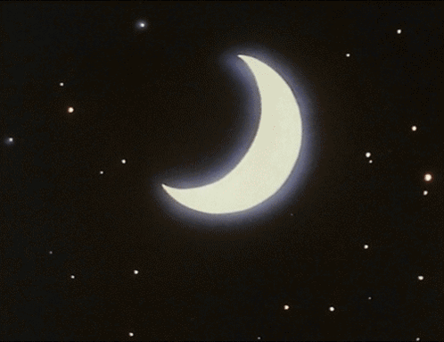 A Crescent Moon With A Blue Beam Coming Out Of It In The Night Sky GIF