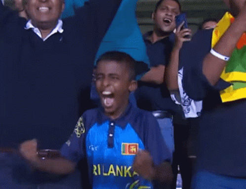 A Cricket Player From Sri Lanka Is Holding A Bat And Wearing A Helmet GIF