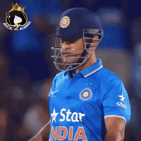 A Cricket Player Is Wearing A Helmet And A Blue Shirt That Says Star India GIF