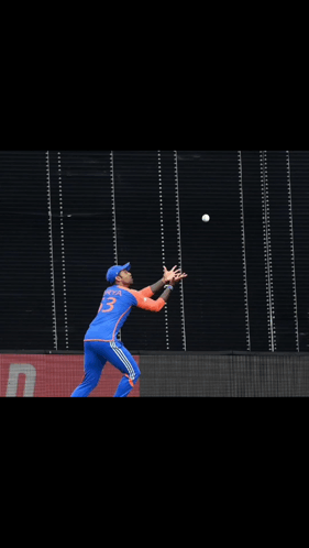A Cricket Player Wearing A Blue Jersey With The Number 23 On It GIF