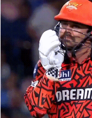 A Cricket Player Wearing A Helmet And A Jersey That Says Dream GIF