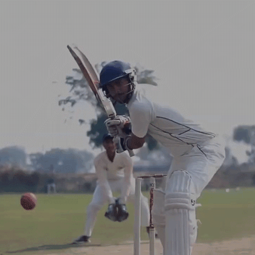 A Cricket Player Wearing A Helmet And Gloves With The Letters Sb On The Bat GIF